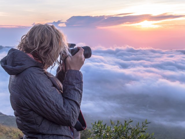Woman Photographer on Mountain Sunset APR Photo Competition