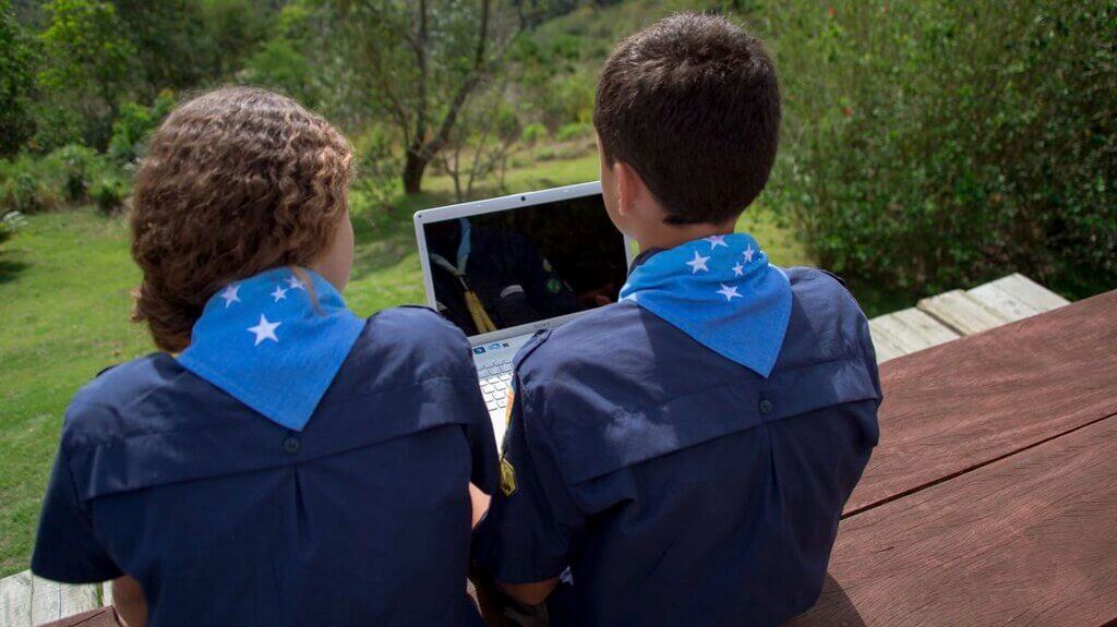 Program conference Two Scouts Sitting Watching Laptop