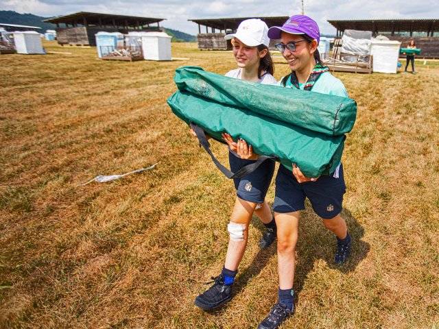 Two Scouts Carrying Equipment on Camp School and Qualifications from Scouting