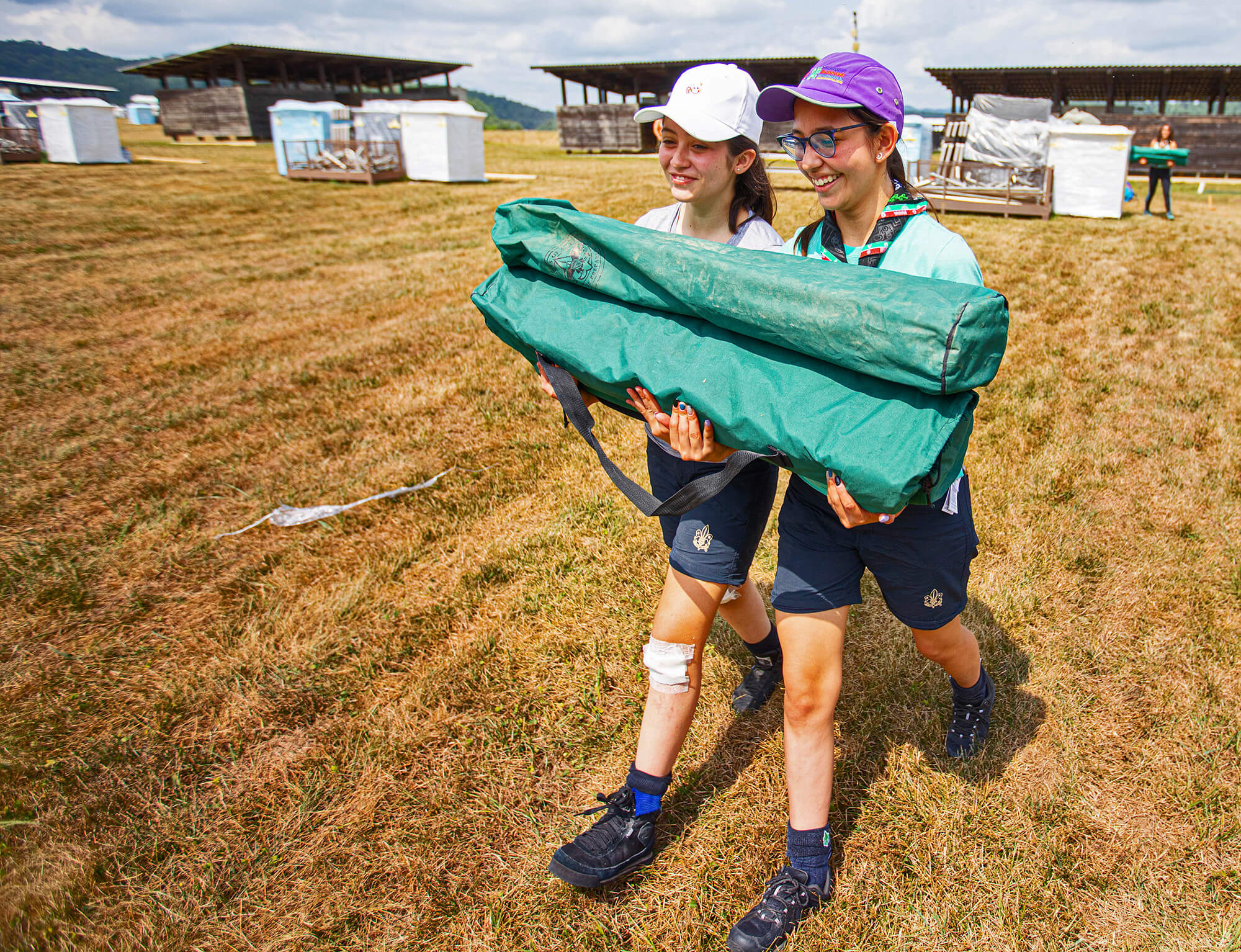 Two Scouts Carrying Equipment on Camp School and Qualifications from Scouting