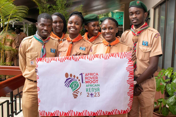 African Rover Scouts holding Poster for Moot