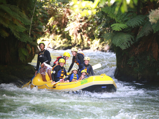 Scouts in Yellow Kayak Rafting Through Canyon