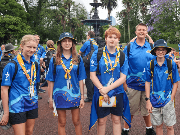 Scouts in Yellow Kayak Rafting Through Canyon